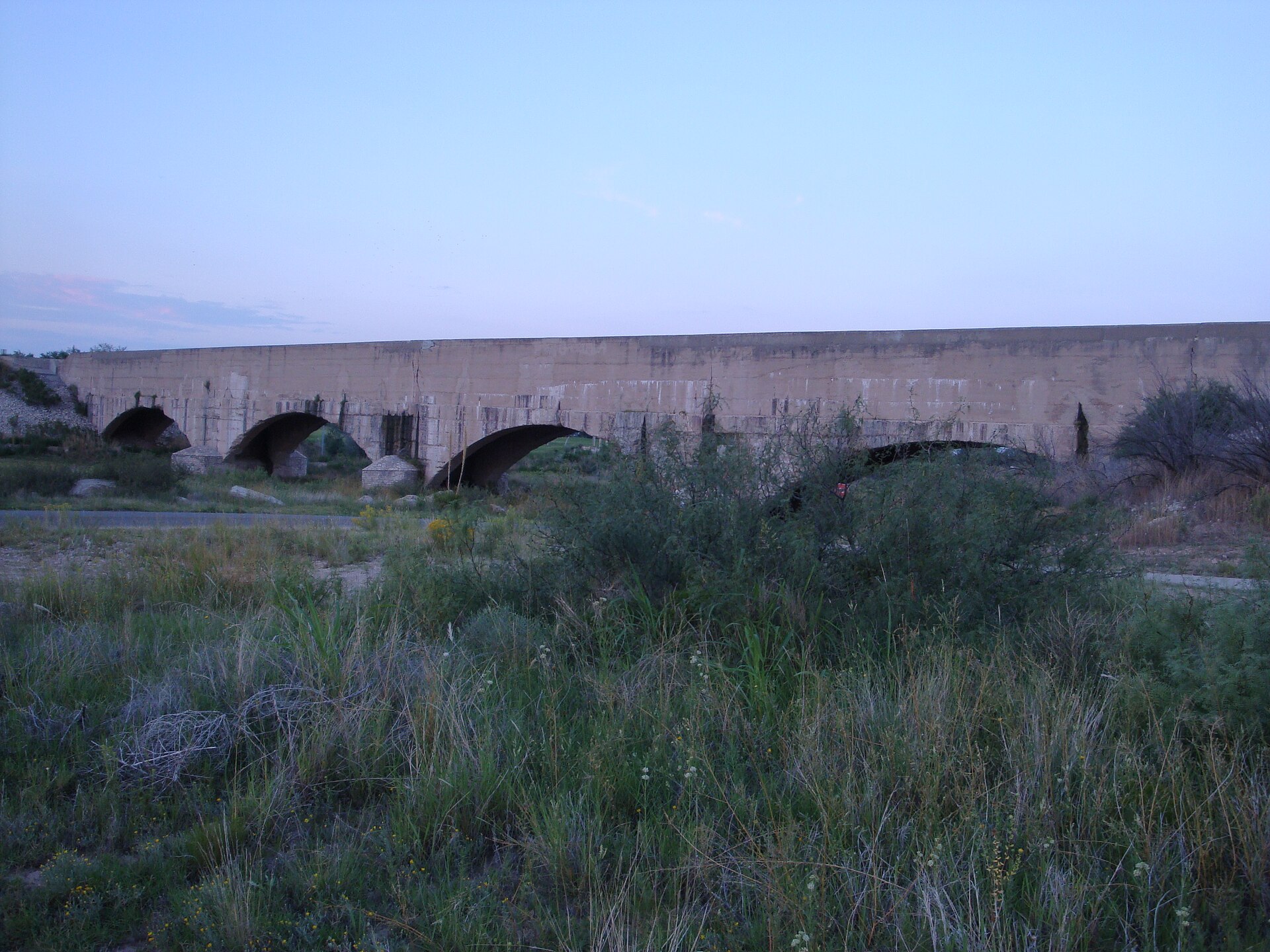 Stone flume crossing the Pecos River near Carlsbad, New Mexico.
