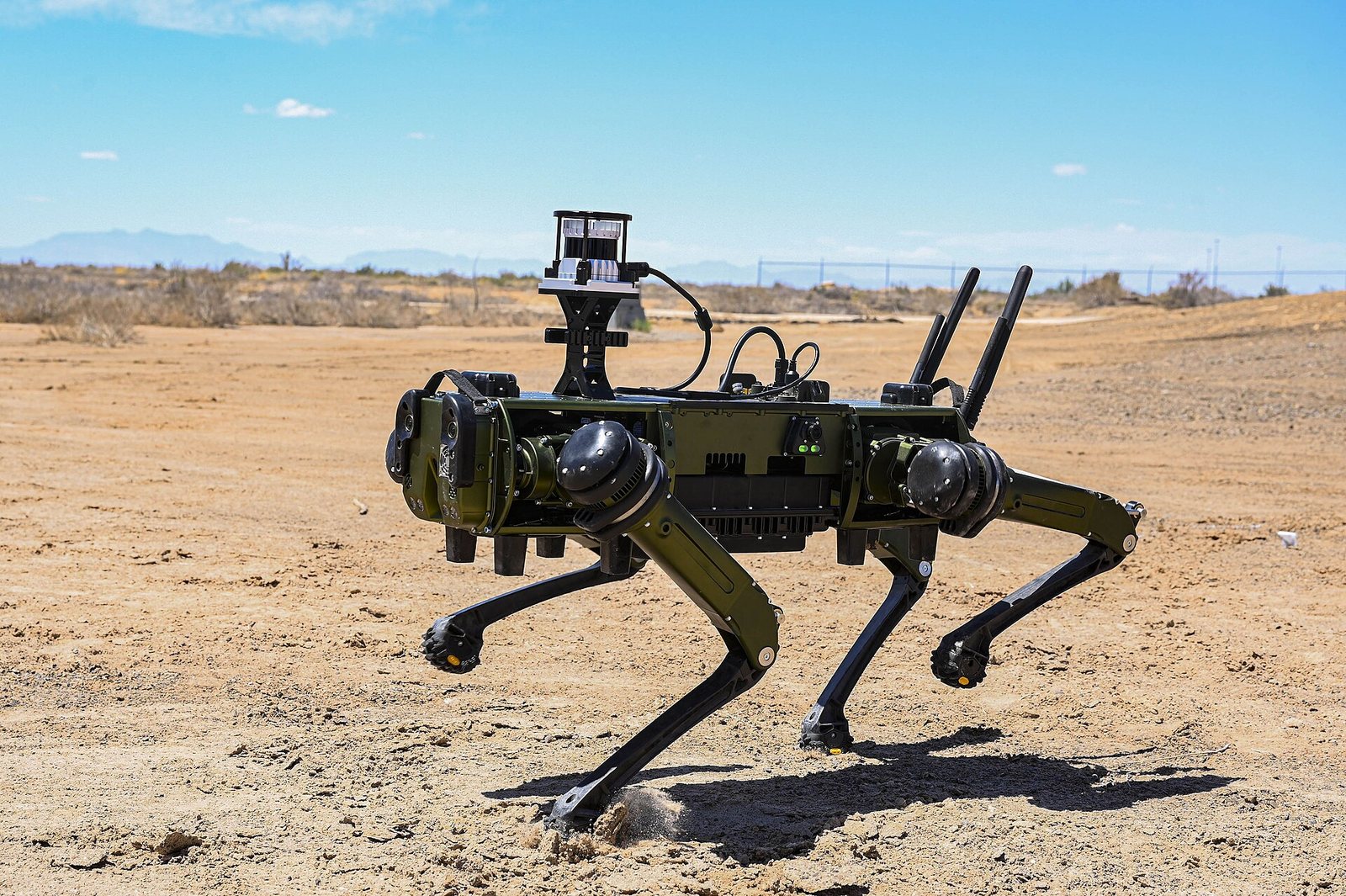 A four-legged ground robot on a field test at Holloman Air Force Base.