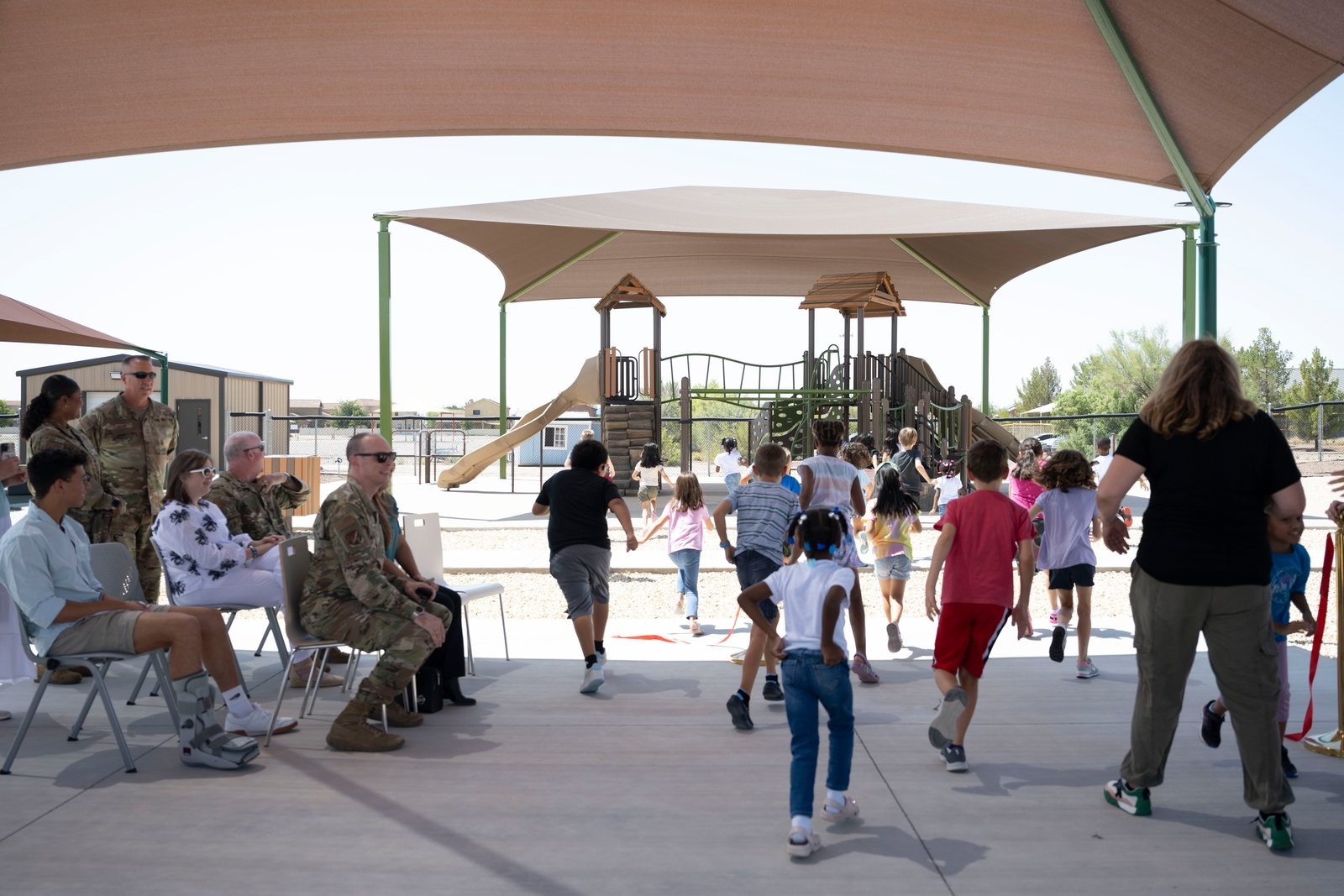 Children play in a newly opened outdoor playground at Holloman Air Force Base.