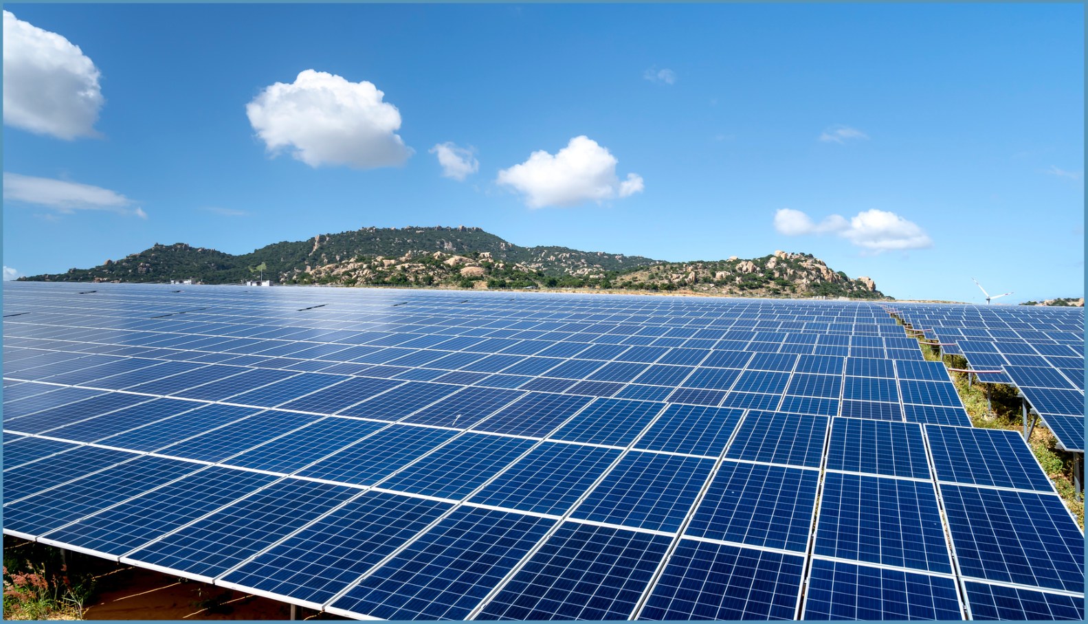 Rows of solar panels in a large solar installation.
