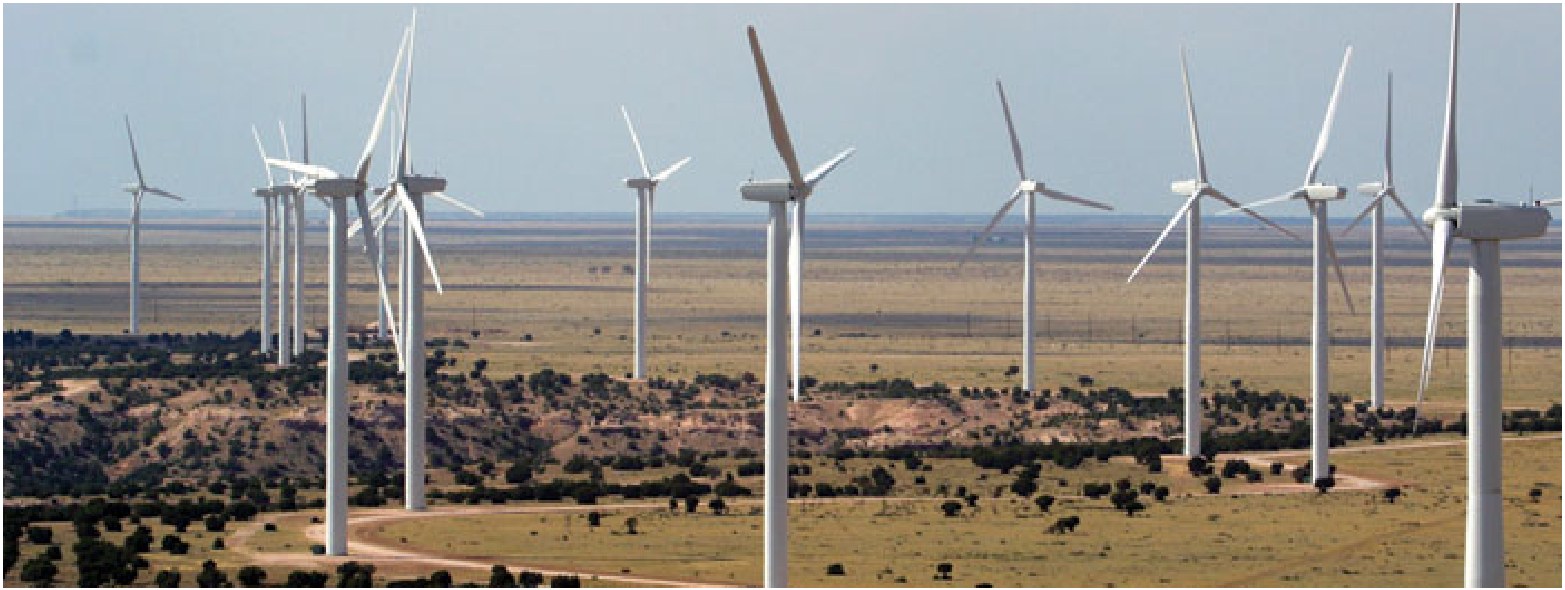 Wind turbines across an open landscape.